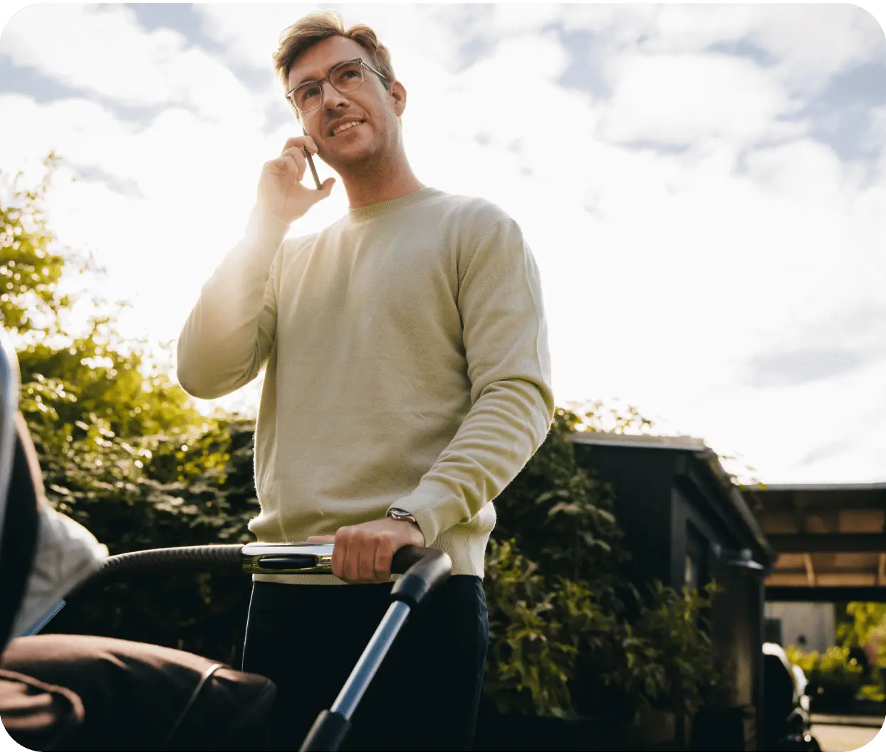 Man on phone pushing stroller